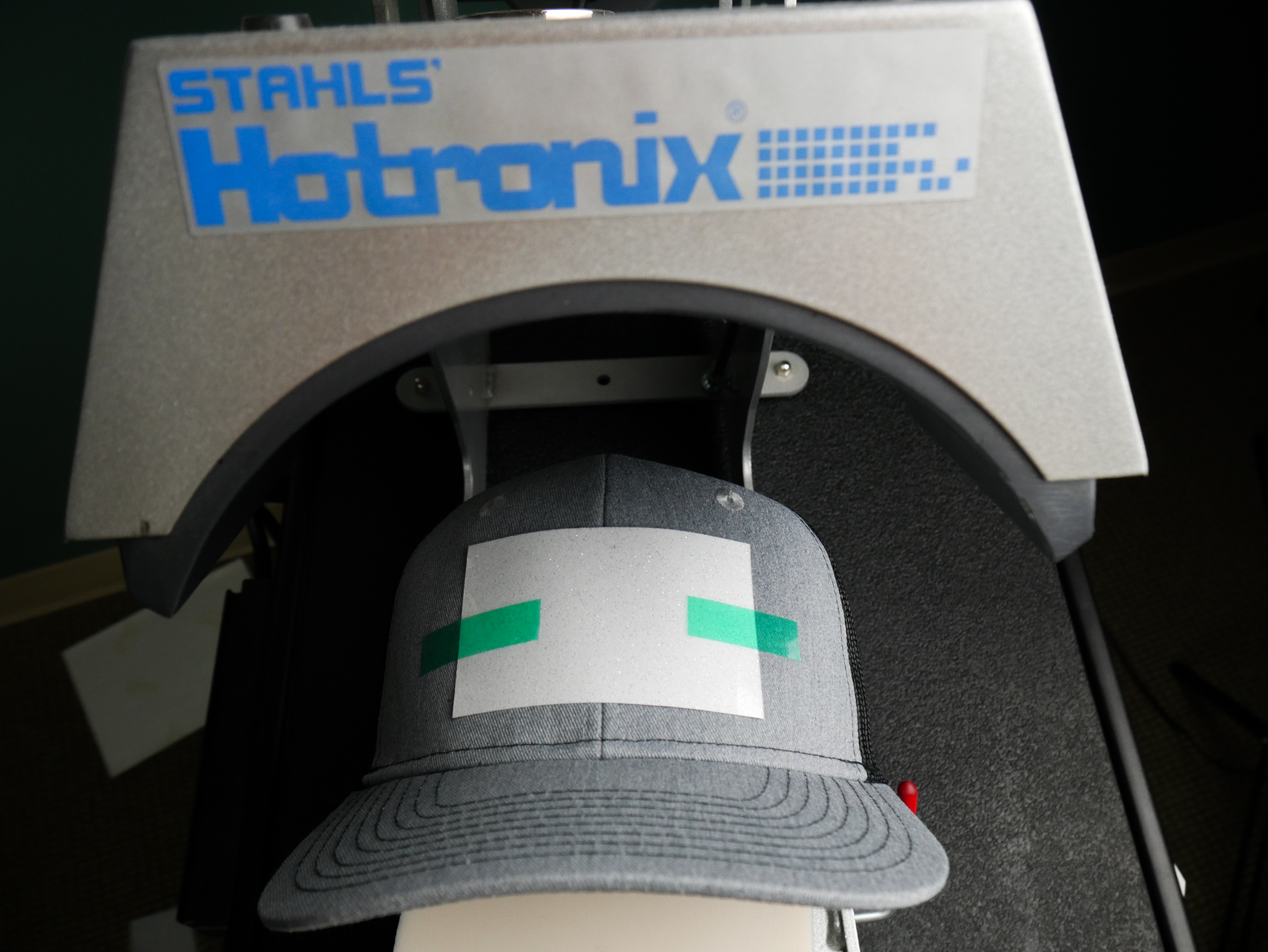 Press your glitter onto your hat with a hat heat press